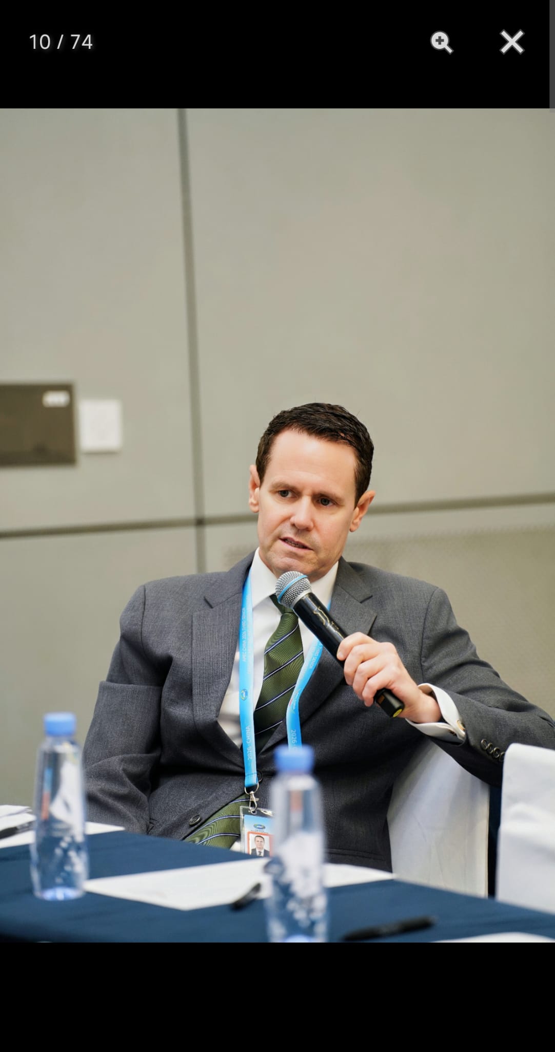 Simon Lacey speaking in Dalian in August 2026